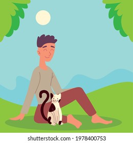 boy with cat outdoor on grass