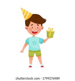 Boy Character in Birthday Hat Carrying Gift Box for Party Vector Illustration