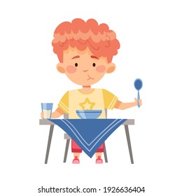 Boy Character Sitting at Table Eating Porridge for Breakfast Vector Illustration
