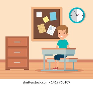 boy child in the classroom with note board and desk
