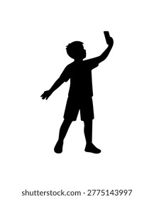 Boy child silhouette holding mobile phone while taking a selfie