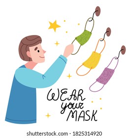 The boy chooses which mask to wear.Choose the mask you need. Coronavirus, COVID-19, flu, disease.