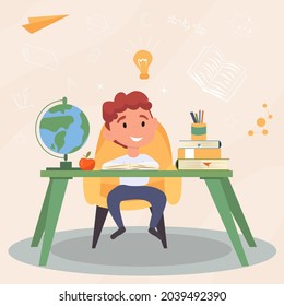 Boy in class at a desk for teaching mathematics with a globe and books