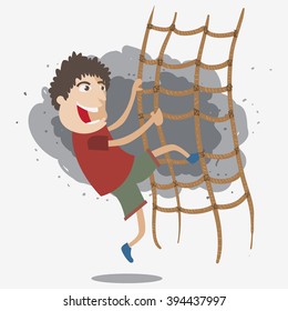 a boy climbing net rope 