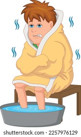 boy cold with feet soaking in warm water