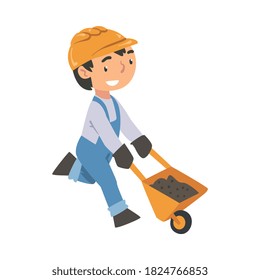 Boy Construction Worker Pushing Wheelbarrow, Cute Little Builder Character Trading Blue Overalls und Hard Hat Cartoon Style Vektorgrafik