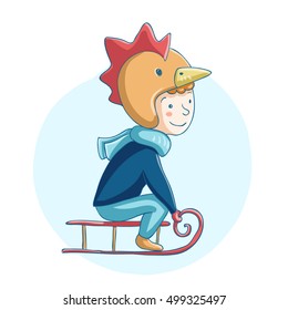 The boy in the costume of a cock on a sled