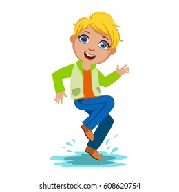 Boy Dancing Splashing Water, Kid In Autumn Clothes In Fall Season Enjoyingn Rain And Rainy Weather, Splashes And Puddles