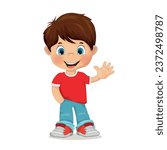 A boy with dark hair and blue eyes smiles and waves