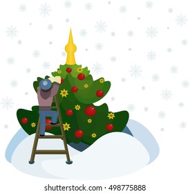 the boy decorates a Christmas tree with red spheres on a white background with snowflakes