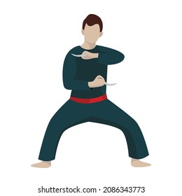 A boy demonstrate a move of the silat, a martial arts from Indonesia. A male athlete holding karambits, a traditional curved knife from Indonesia.