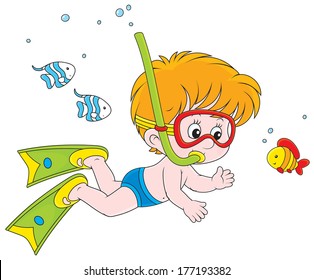 Boy diving with a mask and snorkel among funny fishes