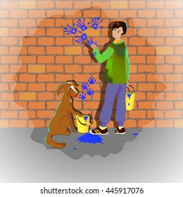 Boy and dog draw hands and feet painted on a brick wall
