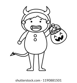 boy dressed up as a halloween devil with candies