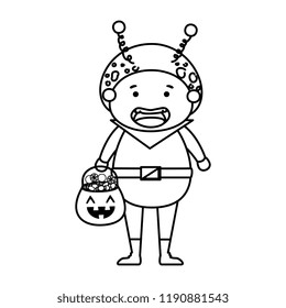 boy dressed up as a halloween martian with candies
