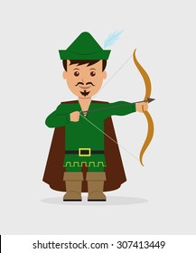 A boy dressed as Robin Hood with bow and arrow. Halloween.