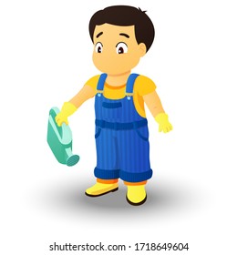 Boy dressed in a shirt, denim overall, watertight boots and gloves holds a watering can in the right hand. Concept of a child helping out with the work around the house or in the garden.