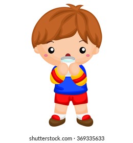 Boy drinking a glass of milk