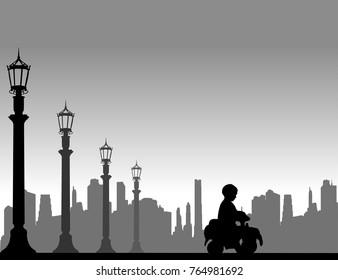 Boy driving a toy car on the street, one in the series of similar images silhouette