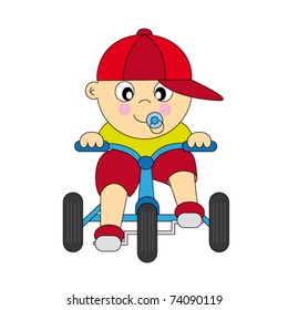 boy driving a tricycle