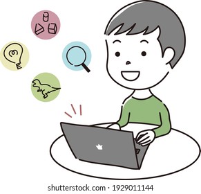 A boy enjoying the internet on a laptop