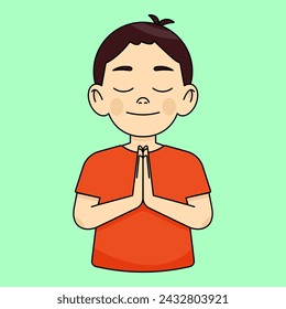 Boy with eyes closed, holding hands in a prayer gesture, praying, making a wish