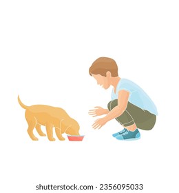 boy feeding dog from a bowl