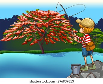 Boy fishing at the river with a beautiful nature surrounding