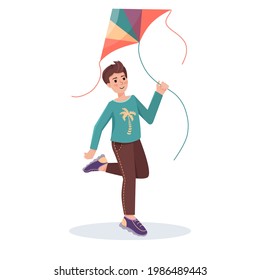 Boy with flying kite in his hands
