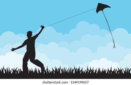 Boy flying a kite with sky background