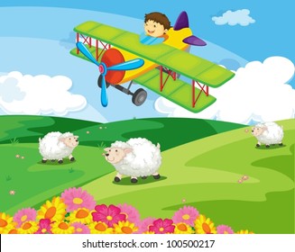 Boy flying over a field with sheep