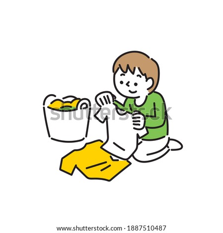 A boy folding laundry neatly
