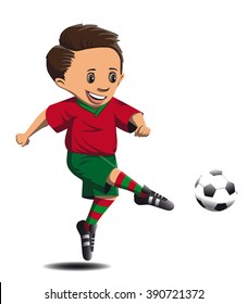 boy football player in a red and green form beats strong foot on the ball