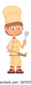 Boy frying pancakes. Chef kid with fry pan and slotted turner