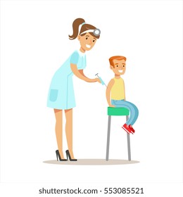 Boy Getting Vaccinated On Medical Check-Up With Female Pediatrician Doctor Doing Physical Examination For The Pre-School Health Inspection