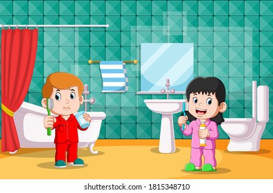 The boy and girl are brushing their teeth in the toilet together