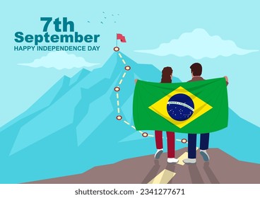 Boy and girl carrying a Brazilian flag on a rock looking up at the mountain top, getting ready to climb up the trail that leads to the peak