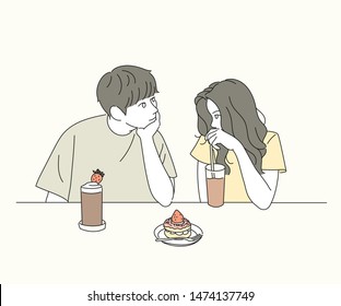 A boy and girl couple are sitting in a cafe and looking at each other tenderly. hand drawn style vector design illustrations. 