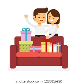 Boy and girl hug each other, smile and look at big bunch of Valentine gifts, which lies on sofa