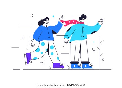 Boy and girl ice skating in cold winter weather
