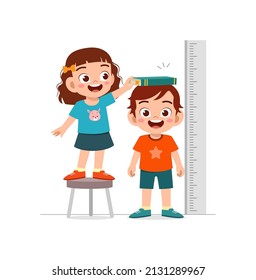 boy and girl measure height for grow progress