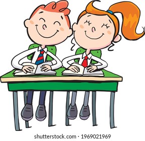 boy and a girl nice children in the school desk