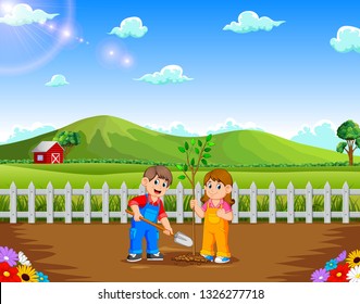 Boy and Girl planting tree in the park