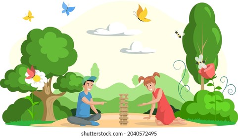 Boy And Girl Playing Jenga Board Game Outdoor. Happy Children Have Fun And Spend Time In Park Together. Kids Sitting In Clearing Near Trees, Flowers, Butterflies, Bees And Bushes, Family Weekend