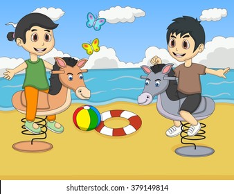 Boy and girl playing rocking horse at the beach