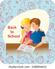 boy and girl schoolboys read a book