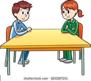 boy and a girl sit at an empty table and chat