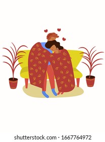 Boy and girl are sitting on the sofa under the covers.