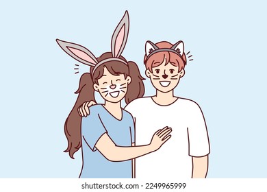 Boy and girl stand hugging with fake animal ears and painted mustaches on faces for homparty or school masquerade. Happy children pretend to be rabbit and cat to spectacle. Flat vector design