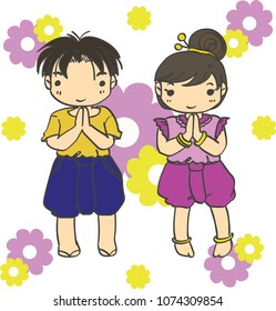 A boy and girl in thai dress.
